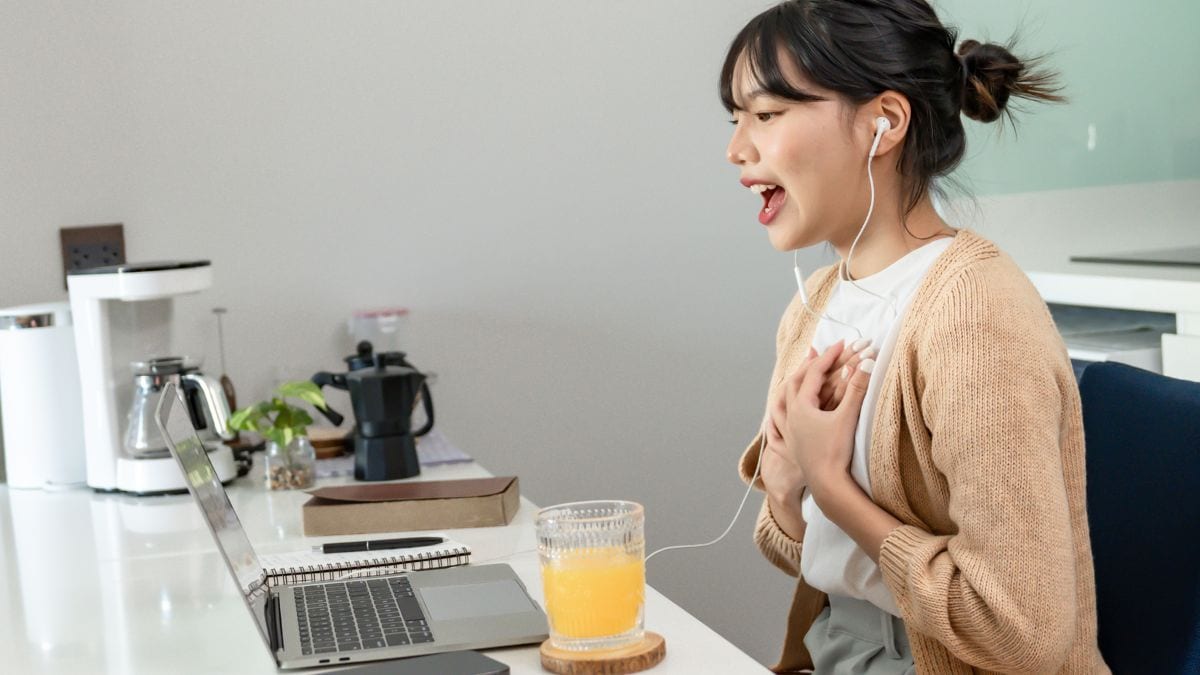 Happy young Asian Woman Successful working with laptop checking